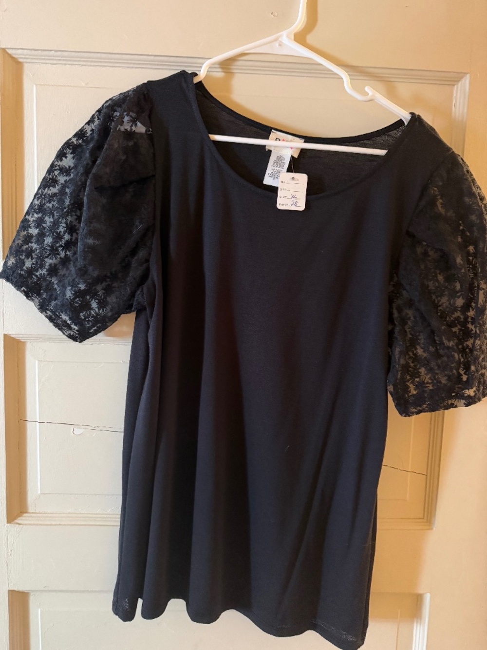 Black, flowery lace sleeves top.